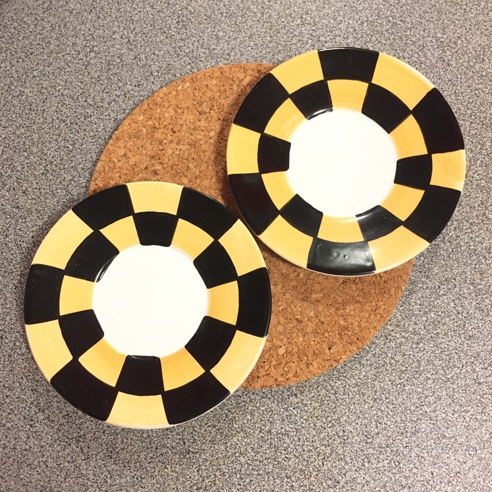 2 small saucers black and yellow checkered pattern